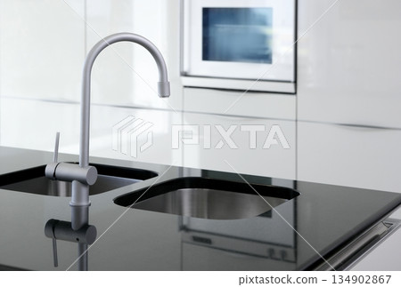 kitchen faucet and oven modern black and white 134902867