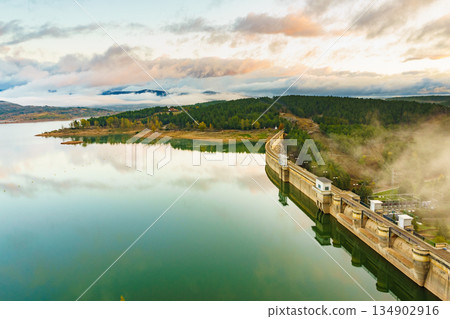 Morning fog over dam on Embalse de Aguilar de Campoo, Spain. Morning fog over dam on Embalse de Aguilar de Campoo, Spain. 134902916