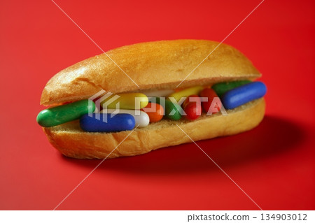 colorful candy on vivid red background colorful candy on vivid red background 134903012