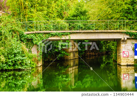 River with bridge. Coulon town in France River with bridge. Coulon town in France 134903444