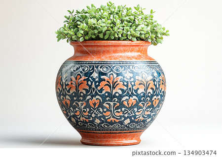 Garden design. Ceramic vase in antique style with patterns in which a boxwood bush grows. Garden design. Ceramic vase in antique style with patterns in which a boxwood bush grows. 134903474