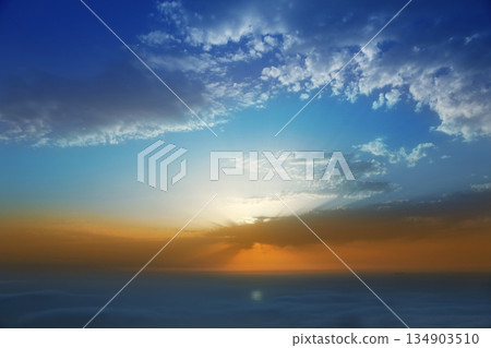 Sunset sky over haze sea of clouds Sunset sky over haze sea of clouds 134903510