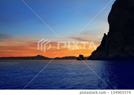 Cape San Antonio Javea Xabia sunset from sea Cape San Antonio Javea Xabia sunset from sea 134903574