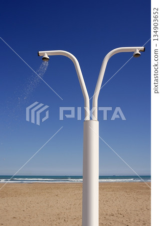 Beach shower over blue sky sand sea 134903652