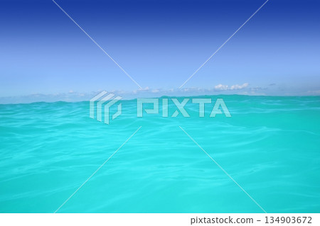 caribbean wave turquoise water horizon line and blue sky caribbean wave turquoise water horizon line and blue sky 134903672