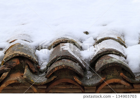 aged clay roof tiles snowed under snow architecture detail aged clay roof tiles snowed under snow architecture detail 134903703