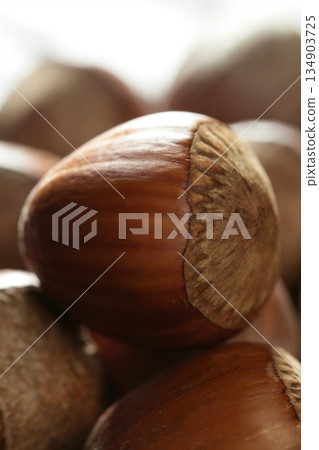 Delicious hazelnuts, macro detail, warm golden light Delicious hazelnuts, macro detail, warm golden light 134903725