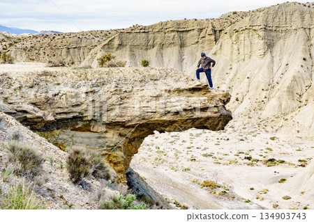 Tourist on Tabernas desert, Spain Tourist on Tabernas desert, Spain 134903743