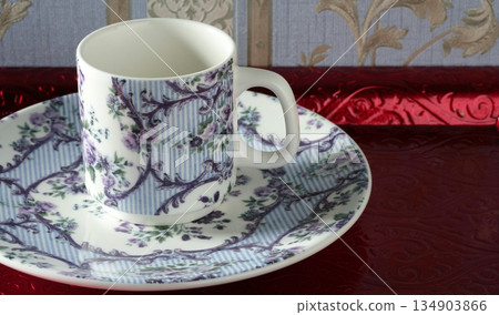 England old style tea cup and dish over red tray 134903866