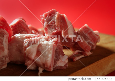 Pig, pork raw meat pieces over red Pig, pork raw meat pieces over red 134903888