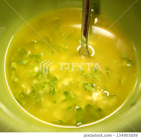 garlic, parsley, lemon and oil spanish sauce garlic, parsley, lemon and oil spanish sauce 134903889