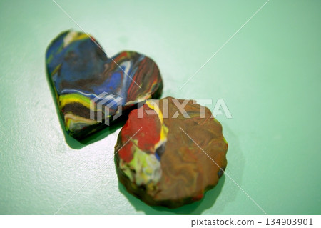 Plasticine brown and blue heart and cookie Plasticine brown and blue heart and cookie 134903901