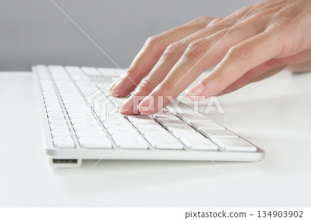woman hands typing keyboard 134903902