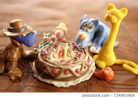 Toy plasticine happy birthday cake over white Toy plasticine happy birthday cake over white 134903909