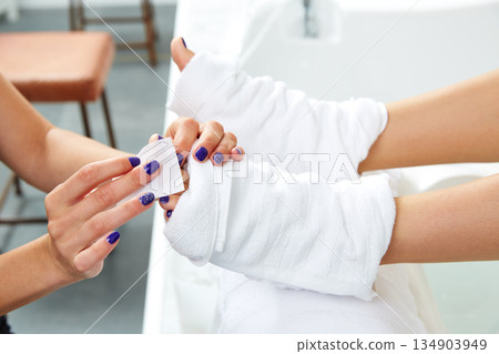 Pedicure treatment to woman feet in nails salon Pedicure treatment to woman feet in nails salon 134903949