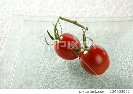 Two cherry tomatoes close-up Two cherry tomatoes close-up 134903951