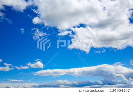 Blue sky with white clouds in a summer day Blue sky with white clouds in a summer day 134904107