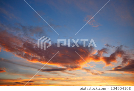 Sunset sky orange clouds over blue 134904108