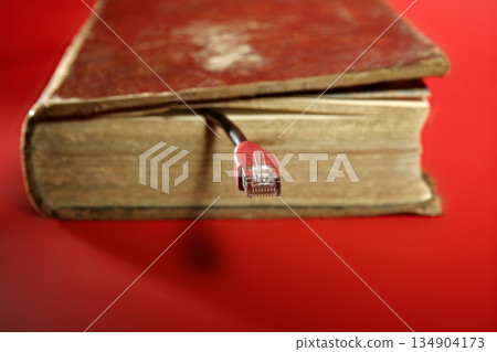 Network RJ45 cable connection coming from old book Network RJ45 cable connection coming from old book 134904173