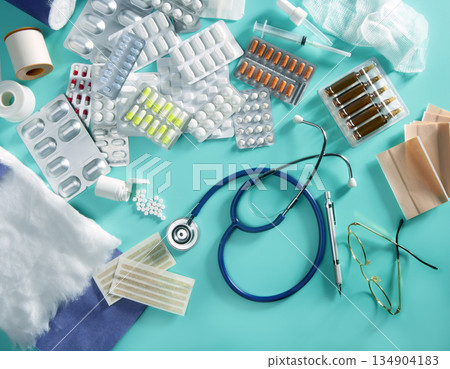 blister medical pills doctor desk pharmaceutical stuff stethoscope green background 134904183