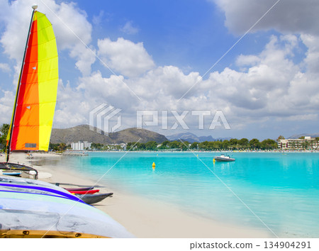 Beach of Puerto de Alcudia in Mallorca with hobie cat Beach of Puerto de Alcudia in Mallorca with hobie cat 134904291