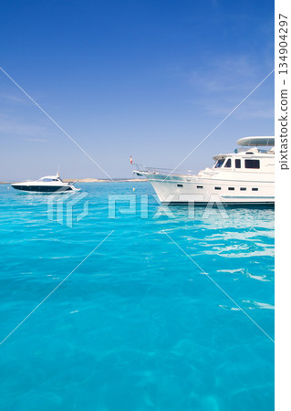 yatch in turquoise beach of Formentera yatch in turquoise beach of Formentera 134904297