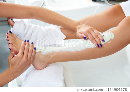 Aplying nourishing moisturizer mask woman legs Aplying nourishing moisturizer mask woman legs 134904378