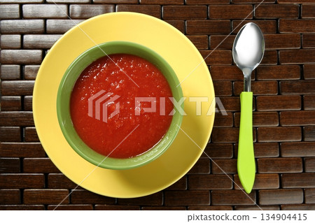 Tomato soup in colorful dish Tomato soup in colorful dish 134904415