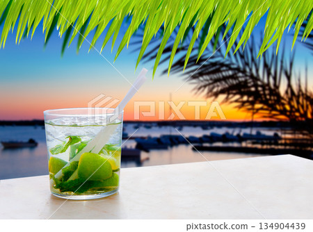 Cocktail Mojito in Balearic island sunset Cocktail Mojito in Balearic island sunset 134904439