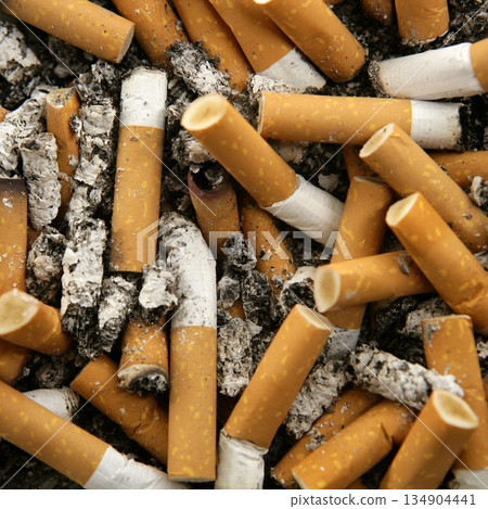cigarettes texture, busy ashtray square still shot cigarettes texture, busy ashtray square still shot 134904441