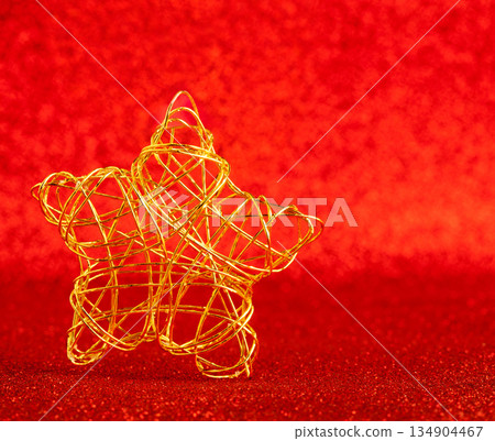 christmas gold wire star on red glitter christmas gold wire star on red glitter 134904467