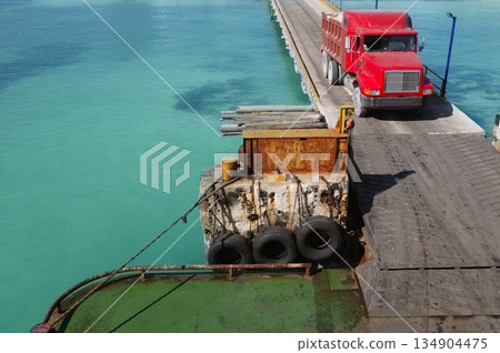 Caribbean gateway ferry with red truck coming aboard the boat Caribbean gateway ferry with red truck coming aboard the boat 134904475