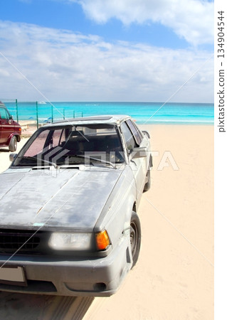 aged grunge car in Mexico Caribbean beach 134904544