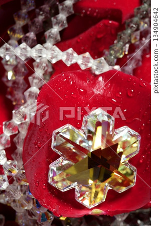 Shiny jewelry over red rose petals 134904642