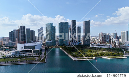 Aerial drone view of Miami skyline with waterfront park and urban canal 134904759
