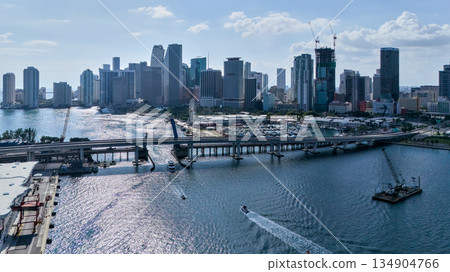 Wide aerial drone view of Miami downtown skyline with bridge over bay Wide aerial drone view of Miami downtown skyline with bridge over bay 134904766