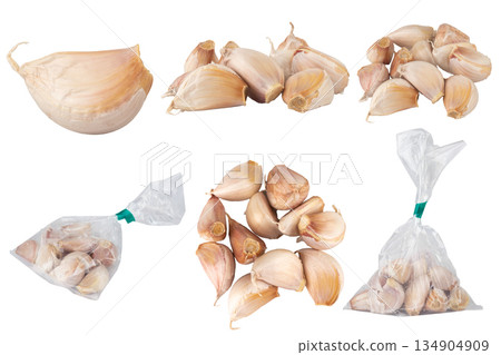 Garlic fell in a pile isolated on white background Garlic fell in a pile isolated on white background 134904909