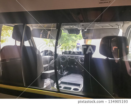 A van with a driver's seat and a passenger seat A van with a driver's seat and a passenger seat 134905193