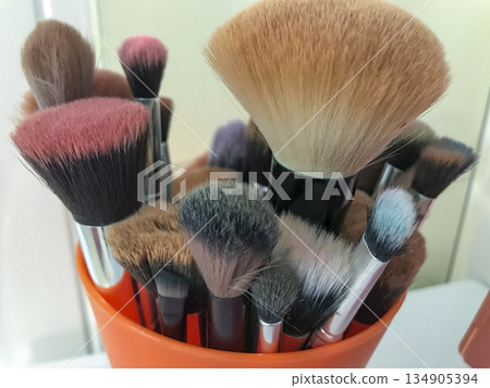 various brushes used for make-up in various shapes, sizes and colours various brushes used for make-up in various shapes, sizes and colours 134905394