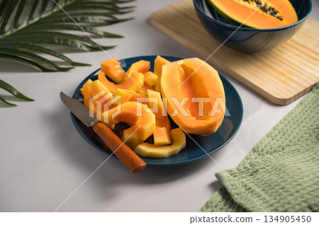 Papaya exotic fruits on plate. Healthy vegan food. Papaya exotic fruits on plate. Healthy vegan food. 134905450