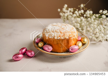 Easter cake with chocolate easter eggs and gypsophila flowers. Spring holidays Easter cake with chocolate easter eggs and gypsophila flowers. Spring holidays 134905453