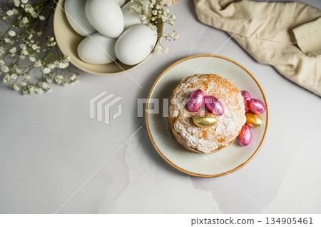 Easter cake with chocolate easter eggs, white easter eggs and gypsophila flowers. Spring holidays Easter cake with chocolate easter eggs, white easter eggs and gypsophila flowers. Spring holidays 134905461