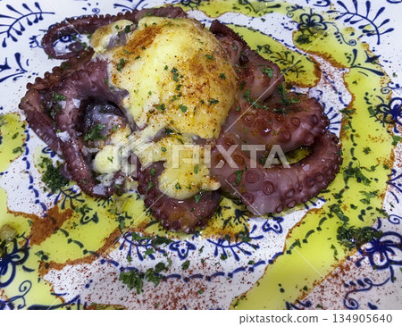 grilled octopus dish with garlic, oil and red pepper sauce grilled octopus dish with garlic, oil and red pepper sauce 134905640