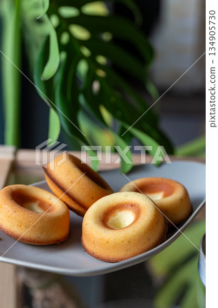 Golden handmade pastries with berry fillings, Gugelhupf and donut-shaped pound cakes Golden handmade pastries with berry fillings, Gugelhupf and donut-shaped pound cakes 134905730