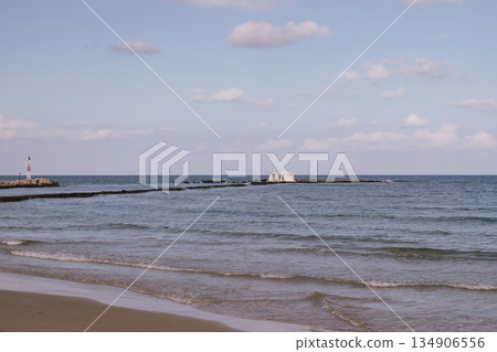 Seaside chapel view with stone path in Georgioupolis Crete Seaside chapel view with stone path in Georgioupolis Crete 134906556