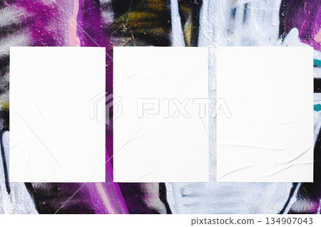 colorful urban wall texture with three wrinkled glued poster templates 134907043