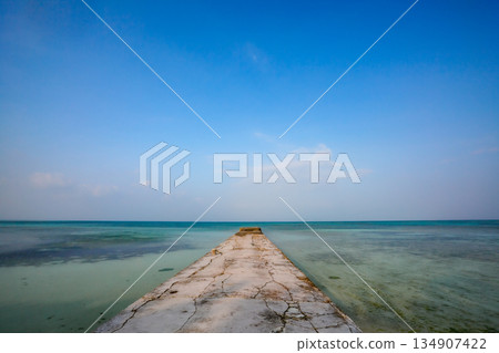 An old pier stretching out into the sea on Ishigaki Island An old pier stretching out into the sea on Ishigaki Island 134907422