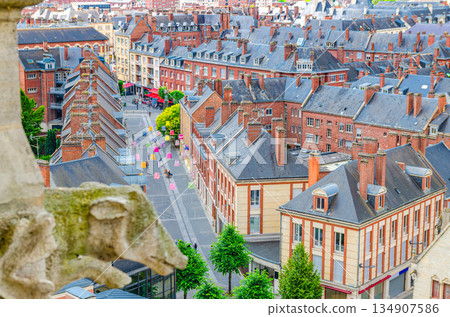 Aerial top view of Amiens historical city centre with old quarter with brick buildings and street with multicolored chinese lanterns, Somme department, Hauts-de-France Region, Northern France 134907586