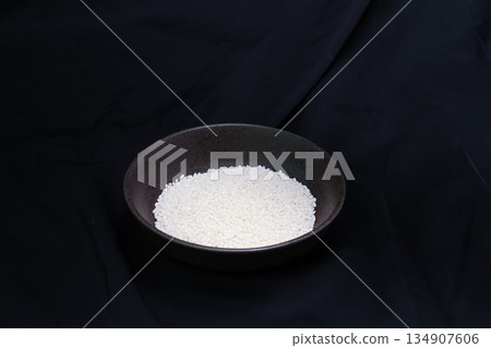 Sticky rice in a bowl on a black background 134907606