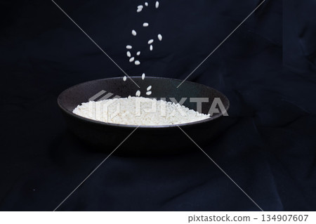 Sticky rice in a bowl on a black background 134907607